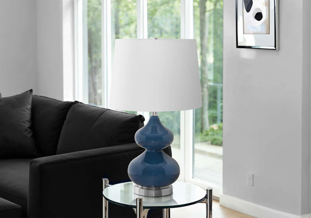 Blue crystal glass children's desk lamp with cloth shade on bedside table