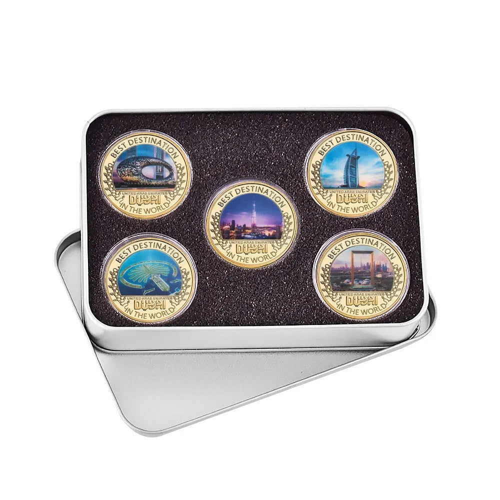 Five iron commemorative coins with Dubai building designs in a gift box