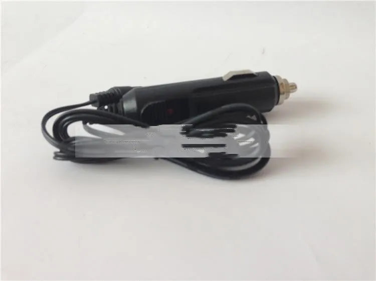 GKL112 compact white dual USB-A port car charger plugged into a vehicle's 12V socket.