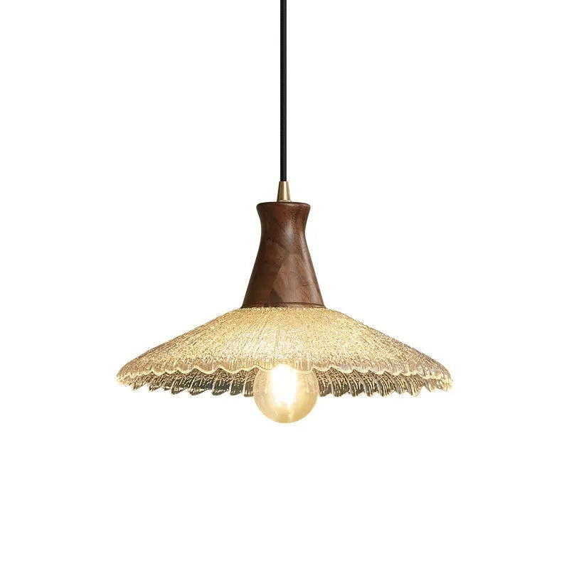 Brass and glass wooden chandelier ceiling light with clear shades in three available sizes.
