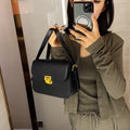 Soft PU leather women's cross-body bag with textured finish in horizontal square silhouette