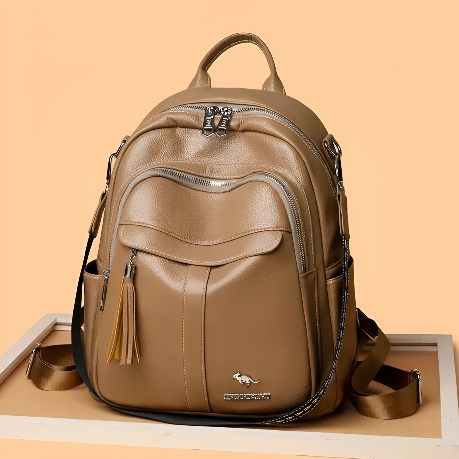 Genuine leather hand-held tassel backpack in khaki with stitching and fringe detail