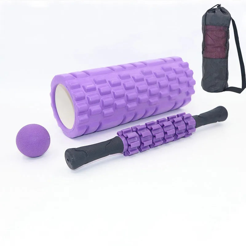Black 33cm fitness foam roller and massage stick set on a grey background.