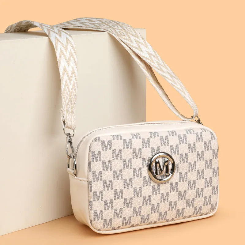 PU leather crossbody bag with wide strap showing three-dimensional front pocket in black colour