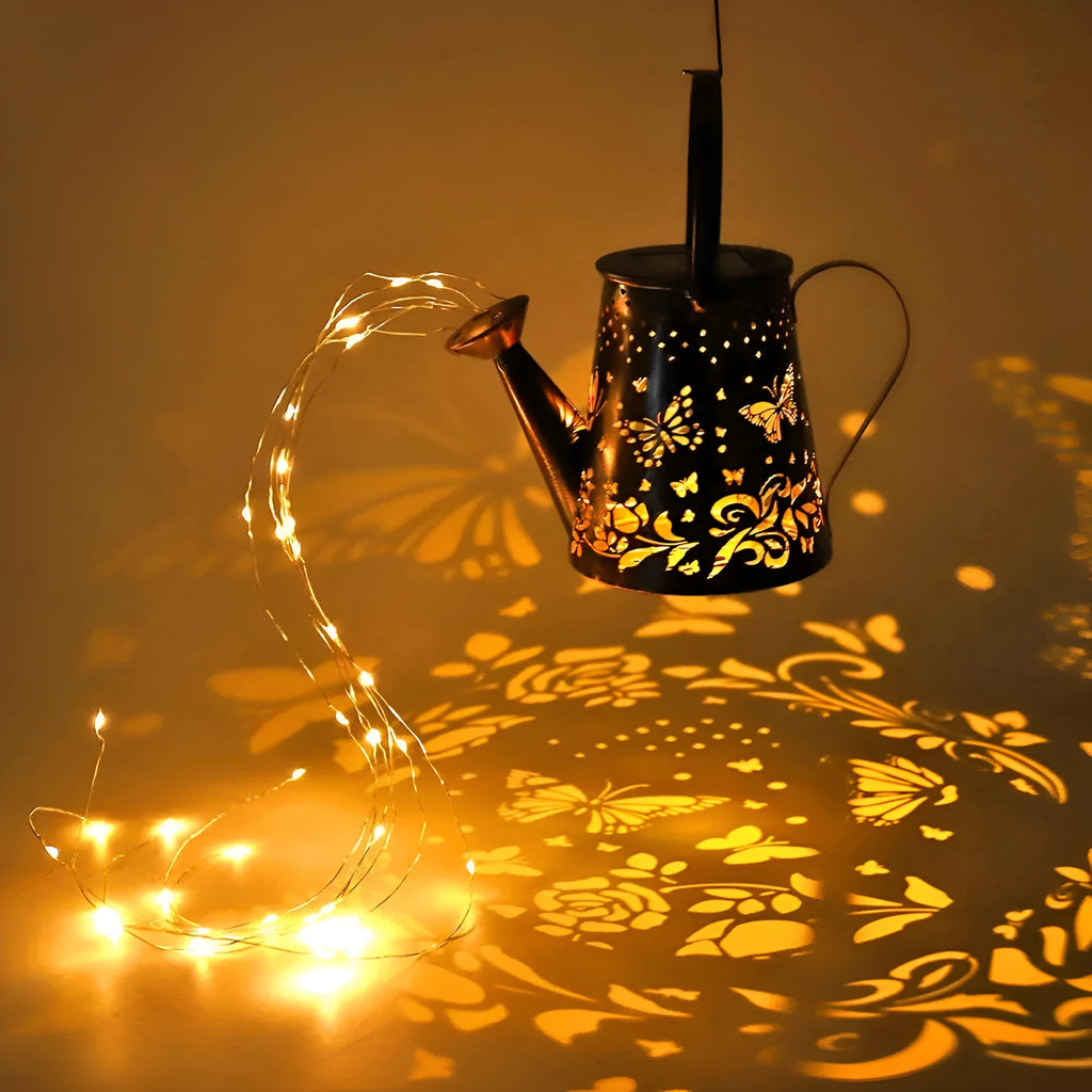 Solar-powered iron garden lamp with a tapered butterfly design emitting warm white light.