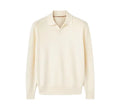 Man wearing a milky white pure wool polo sweater with a lapel collar and loose fit.