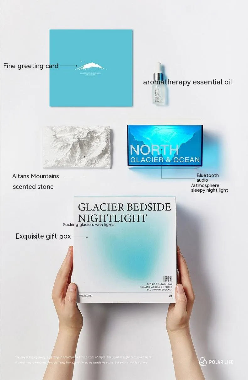 Glacier night light Bluetooth speaker with solid colour glacier pattern on bedside table