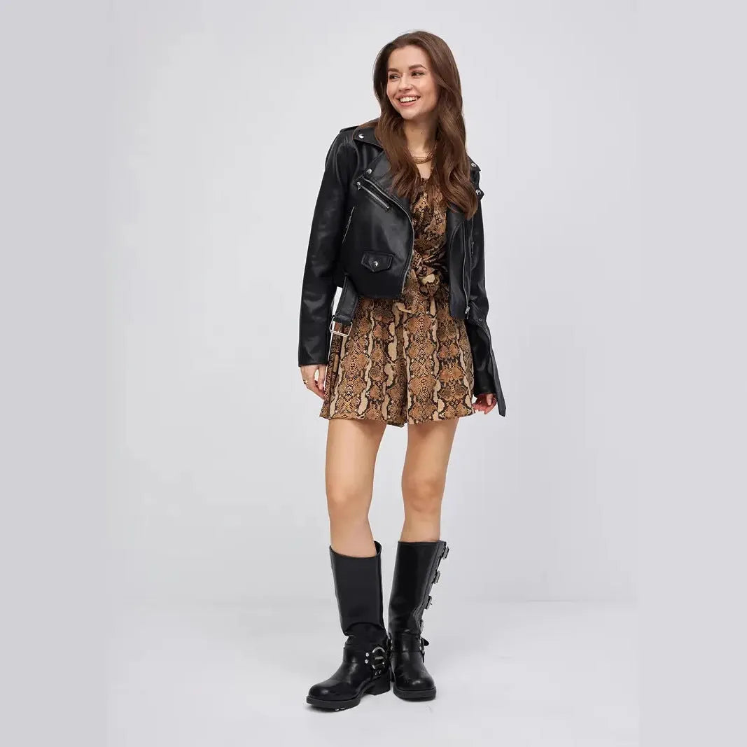 Black women's retro style PU leather coat with regular sleeves on a street fashion background