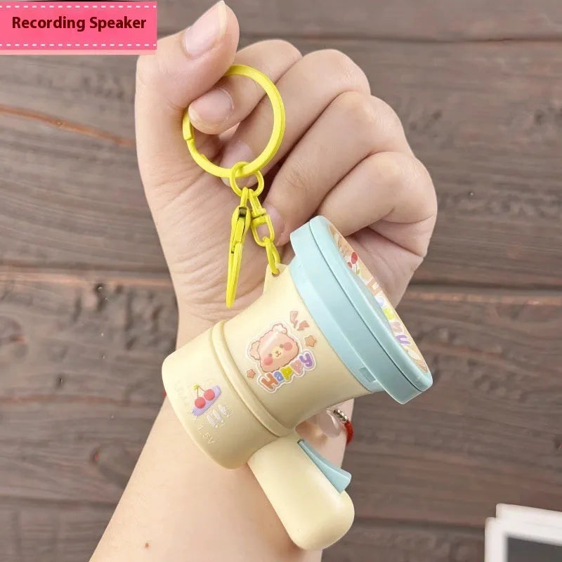 Green and yellow plastic cartoon horn keychain ornament with cute style design