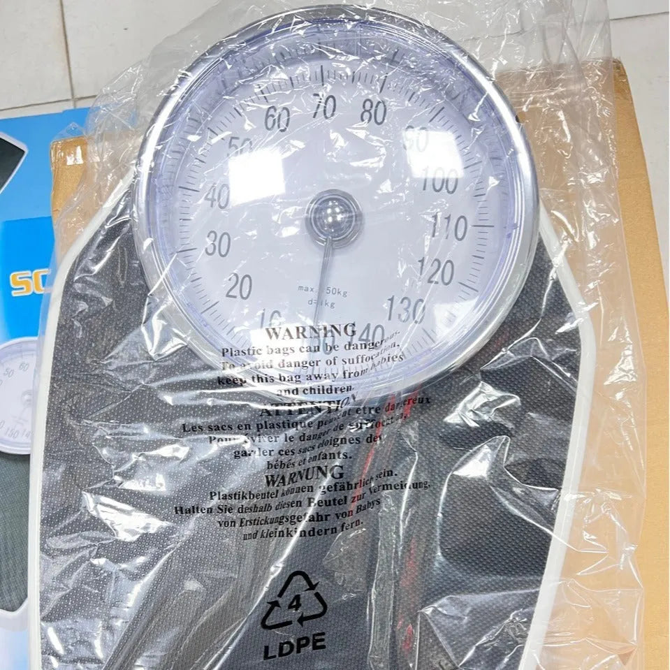 Black mechanical bathroom scale with large dial on a 47x35cm platform.