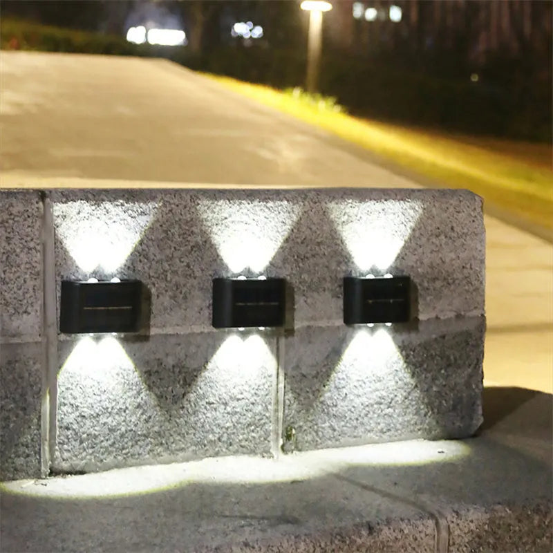 Solar outdoor wall light with up and down glow, black ABS+PC housing, warm white SMD LEDs