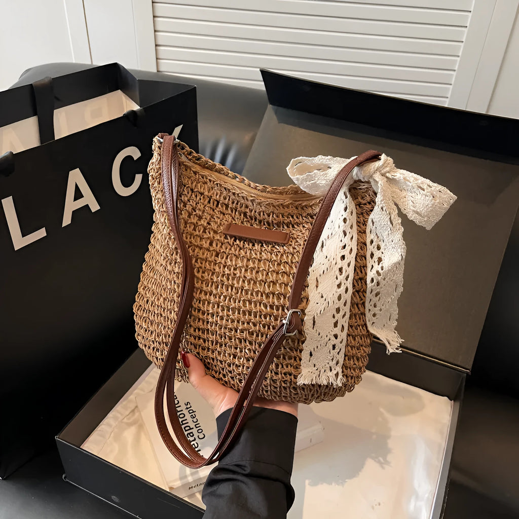 Women's woven straw messenger bag with hollowed pattern in khaki colour with zipper compartment