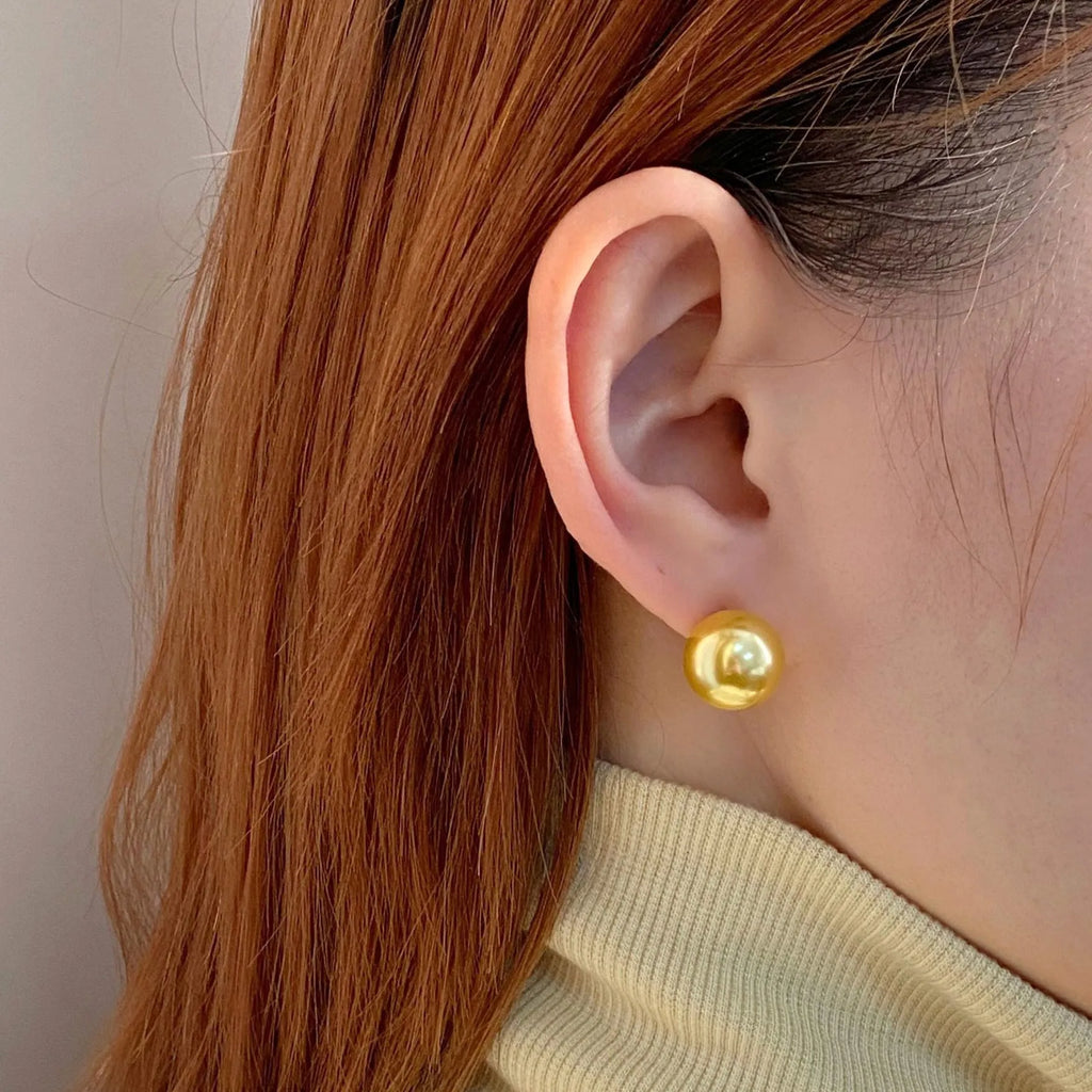 Retro geometric pearl stud earrings for women with an eight-point star design on silver setting.