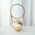 Round PVC dinner bag with electroplating handle and stitching detail in gold, measuring 25x11x15cm