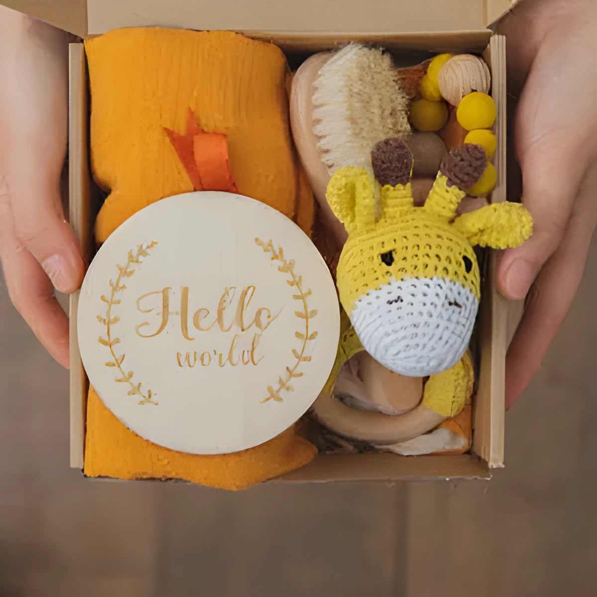 Baby teething gift set with bamboo gauze blanket, wooden chewing ring, woven bell, and developmental toys