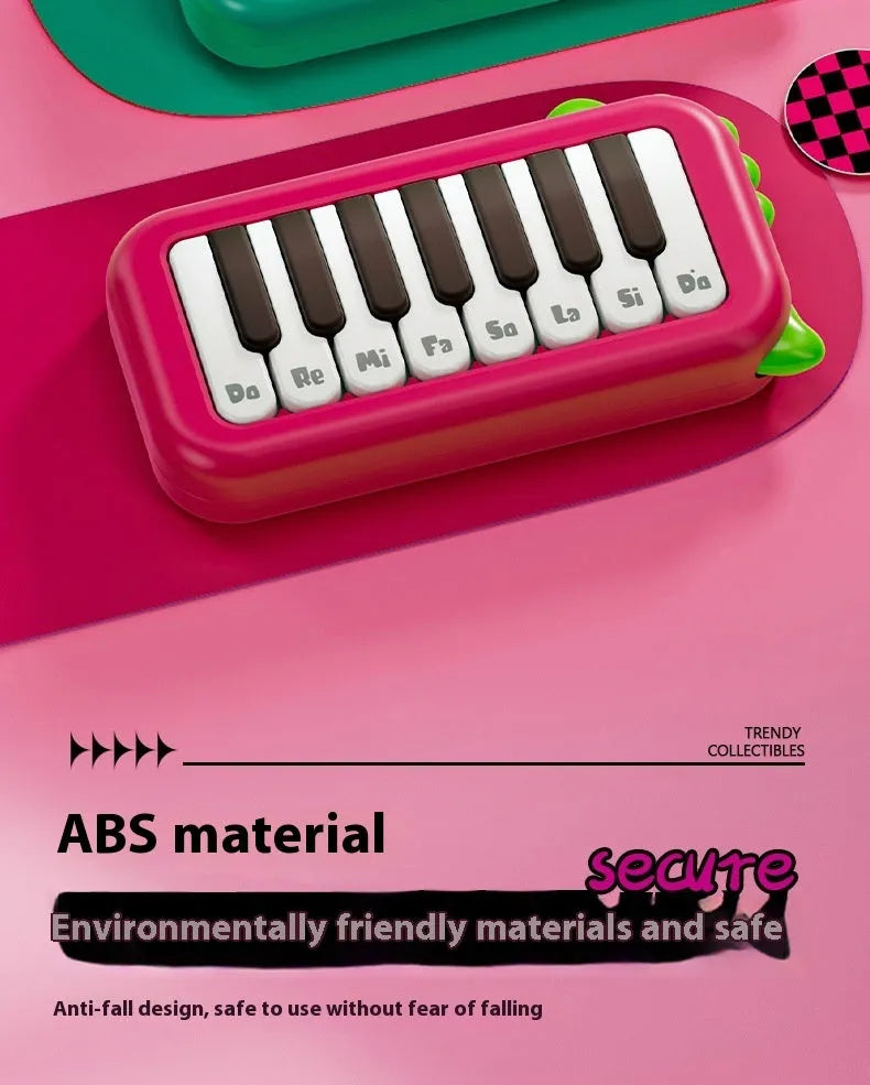 Pocket electronic keyboard little piano pattern toy for children in green and pink plastic.