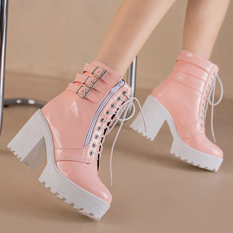 Women's black thick-heeled ankle boots with a lace-up front and waterproof platform on a rubber sole.