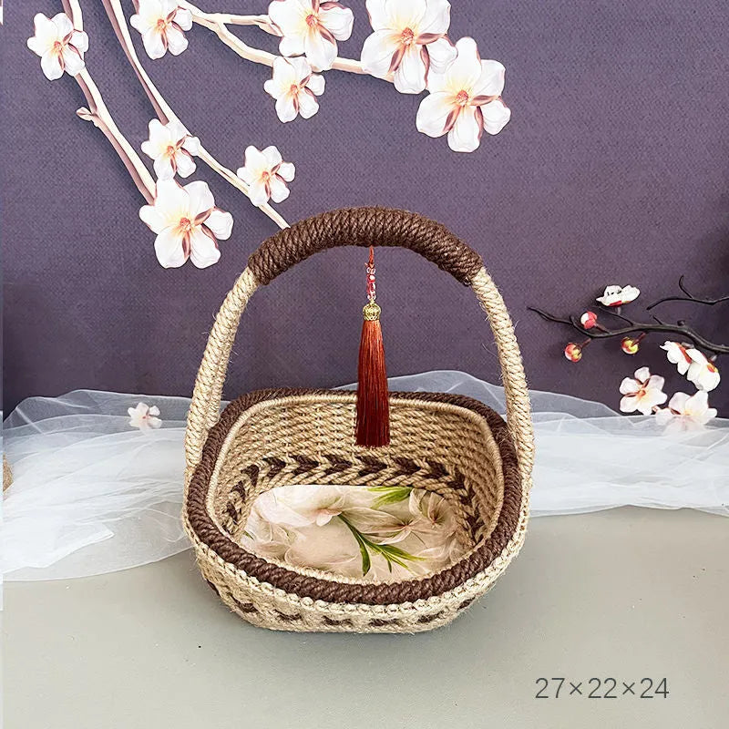 Hand-woven straw basket with hemp rope detail in coffee brown colour.