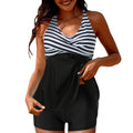 Women's plus-size floral pyjama set with top and skirt-split boxer trousers.