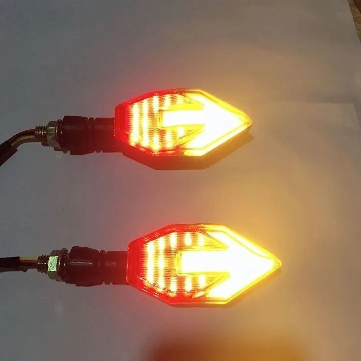 Arrow-shaped LED motorcycle turn signal lamp in ABS plastic housing for 12v universal vehicle fit.