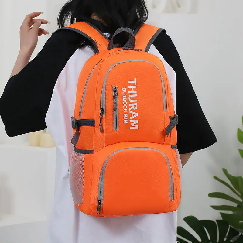 Outdoor folding travel backpack in multiple colours showing adjustable straps and 20-35L capacity.