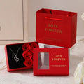 Six red soap roses in a black Korean-style gift box with a matching handbag