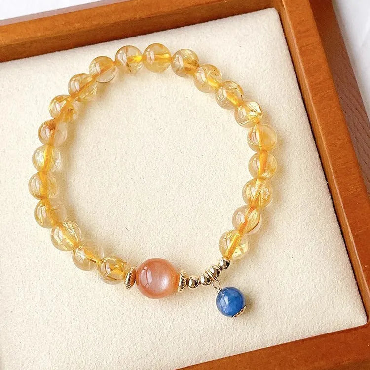 Gold rutilated quartz and sunstone crystal bracelet with diamond beads on adjustable band