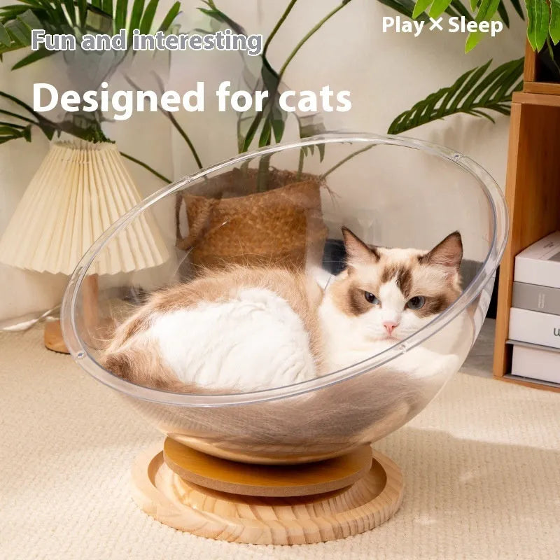 Transparent acrylic space capsule-shaped cat bed on a turntable base.