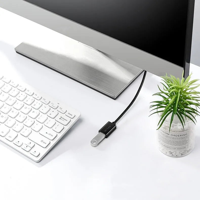 Black USB extension cable with male and female connectors, shown coiled to indicate its available lengths up to 5 metres.