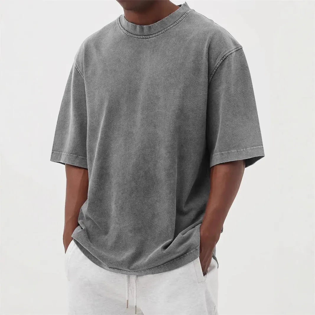 Men's stone washed loose fit t-shirt in a distressed solid colour, shown in Army Green.