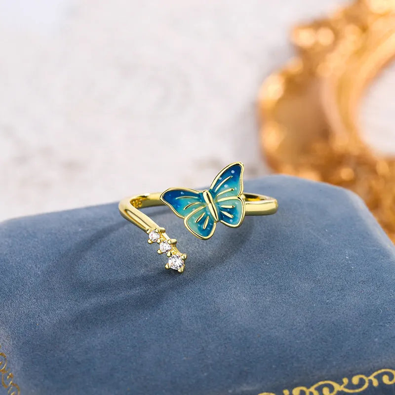 Copper butterfly ring with blue epoxy inlay, adjustable opening, silver colour, simple animal style