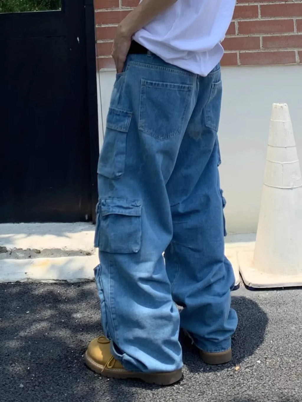 Men's blue straight-leg denim jeans with mid-waist and zip fly