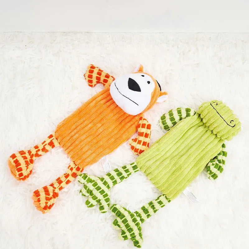 Green and orange durable rubber dog toy with squeaker for aggressive chewers.