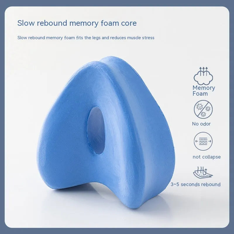 Love heart shaped memory foam leg pillow in dark blue jacquard fabric, shown next to a tape measure indicating 25x23x13 cm dimensions.