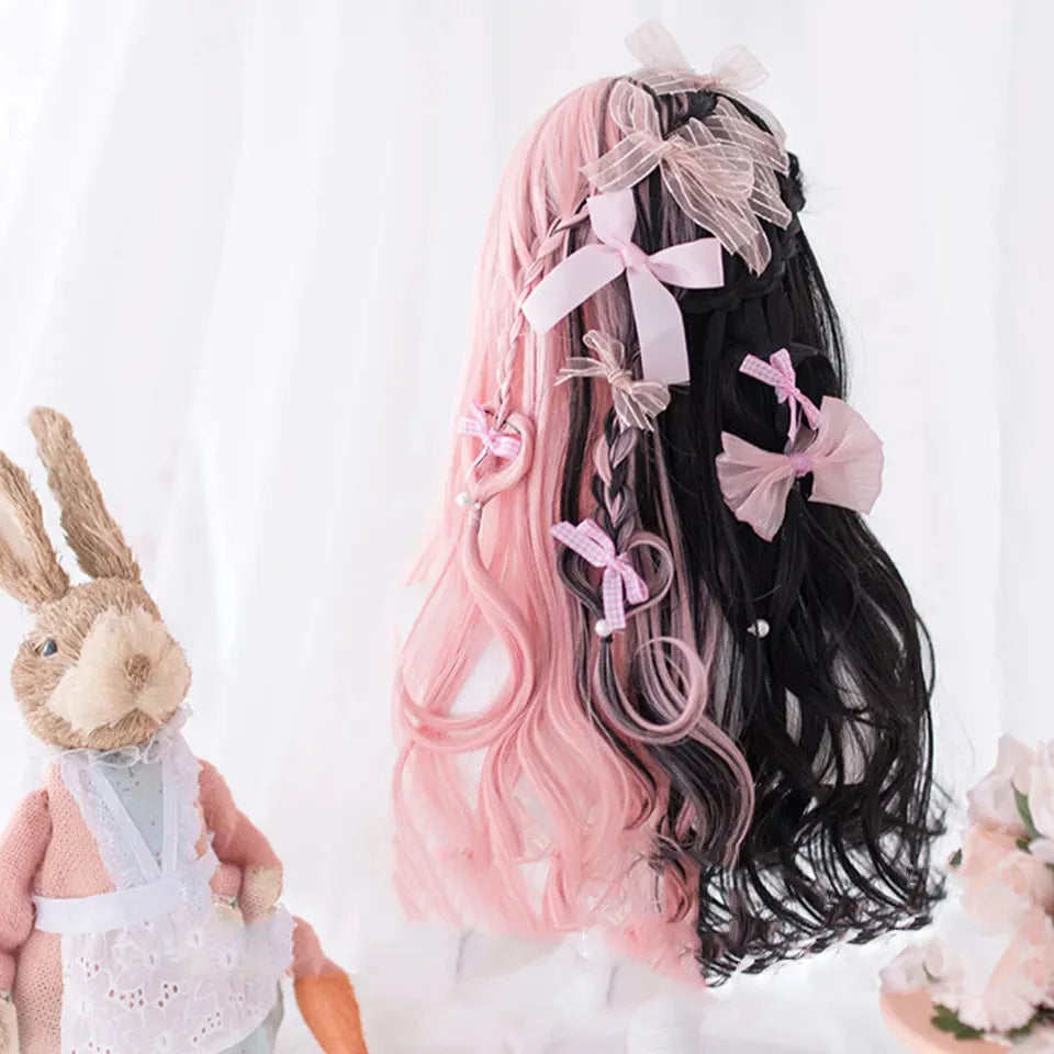 Harajuku Lolita long curly black and pink synthetic cosplay wig with bangs on a stand.