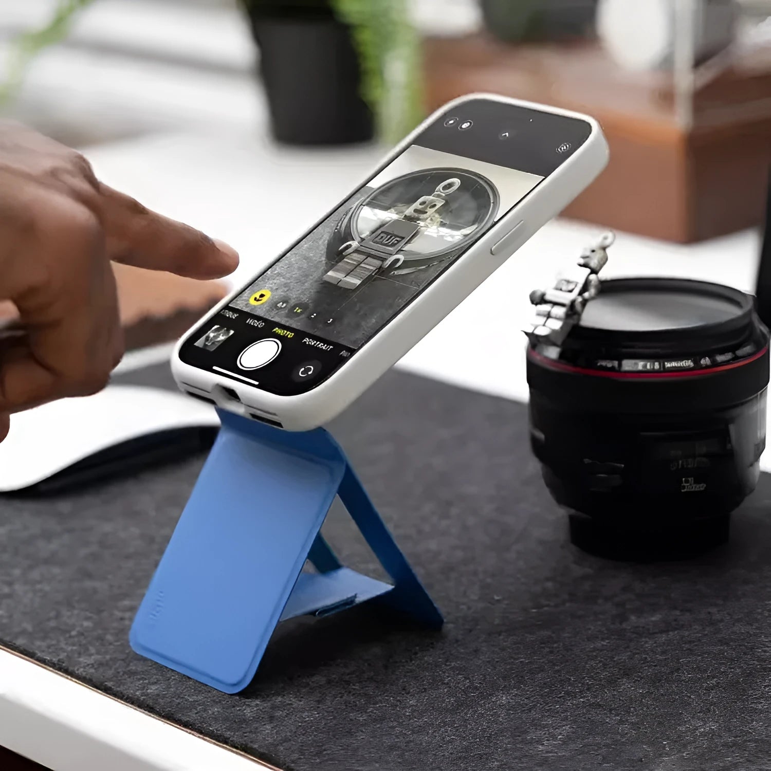 Magnetic mobile phone holder case in MOVAS leather shown in black, blue, green, and grey colour options.