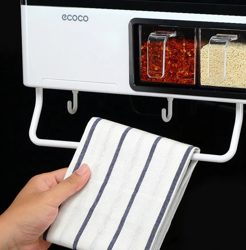 White plastic multi-function wall-mounted kitchen storage rack holding utensils and seasoning bottles