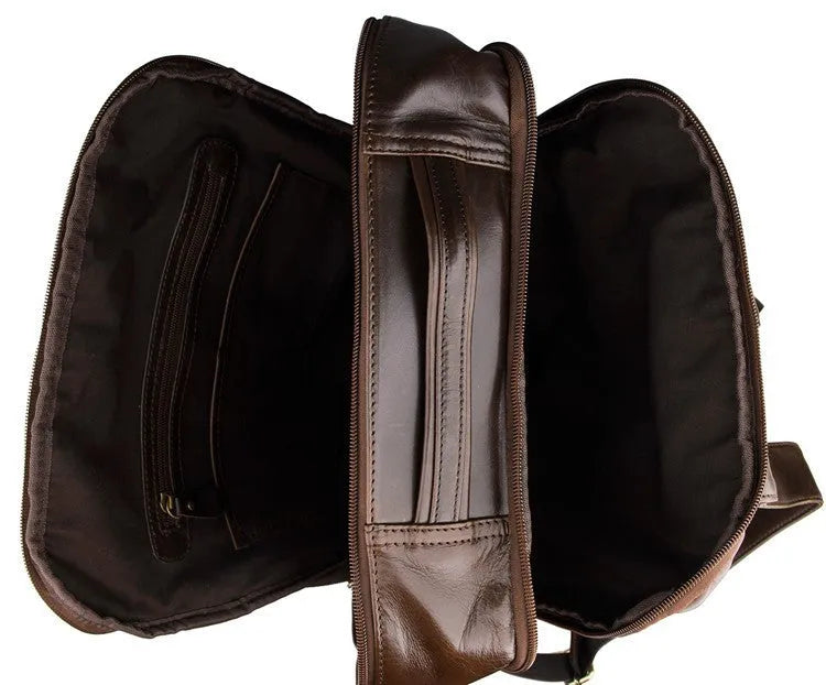 Top layer leather computer backpack in brown colour with zip closure designed to fit a 15 inch laptop