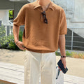 A caramel-colour men's retro knitted polo shirt with short sleeves and an asymmetric design detail on the front.