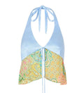 Green halterneck printed lace-up split swimsuit with long bell sleeves on a model