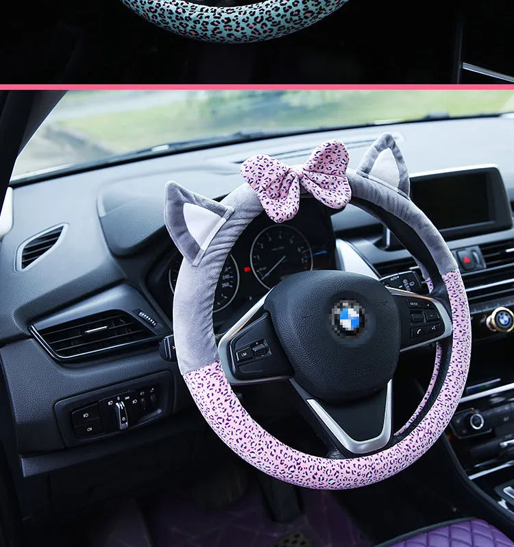 Cute cat ear steering wheel cover in short plush cashmere wool, black colour, on a steering wheel
