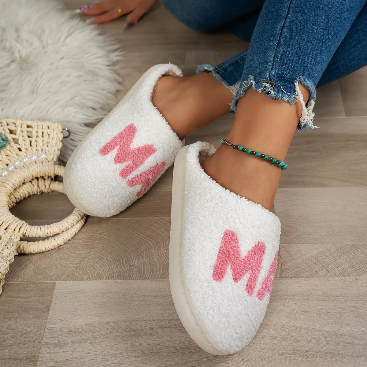 White plush cotton slippers with thick non-slip TPR sole on indoor floor