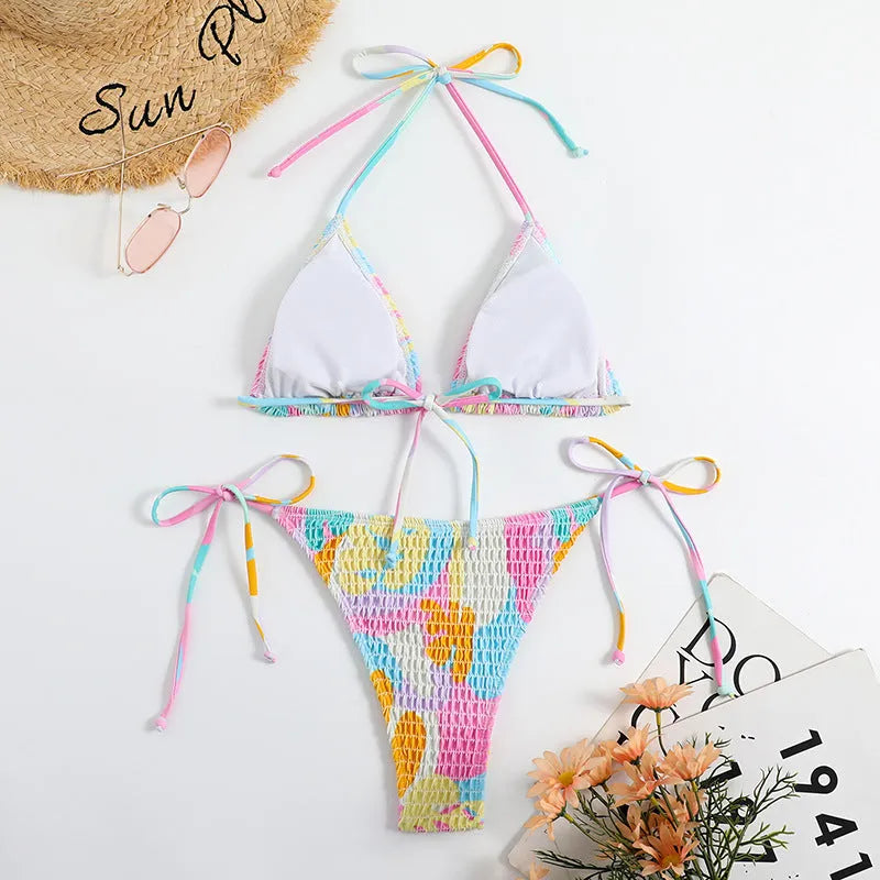 Women's triangle bag bikini swimsuit with printed floral gradient pattern and smocking detail