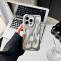 Electroplated hollow flame pattern mobile phone case for iPhone on a dark background, showing silver metallic finish.