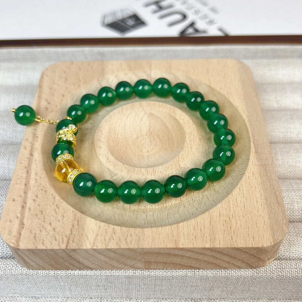 Handcrafted green chalcedony wealth snake and red agate beaded bracelet with copper components.
