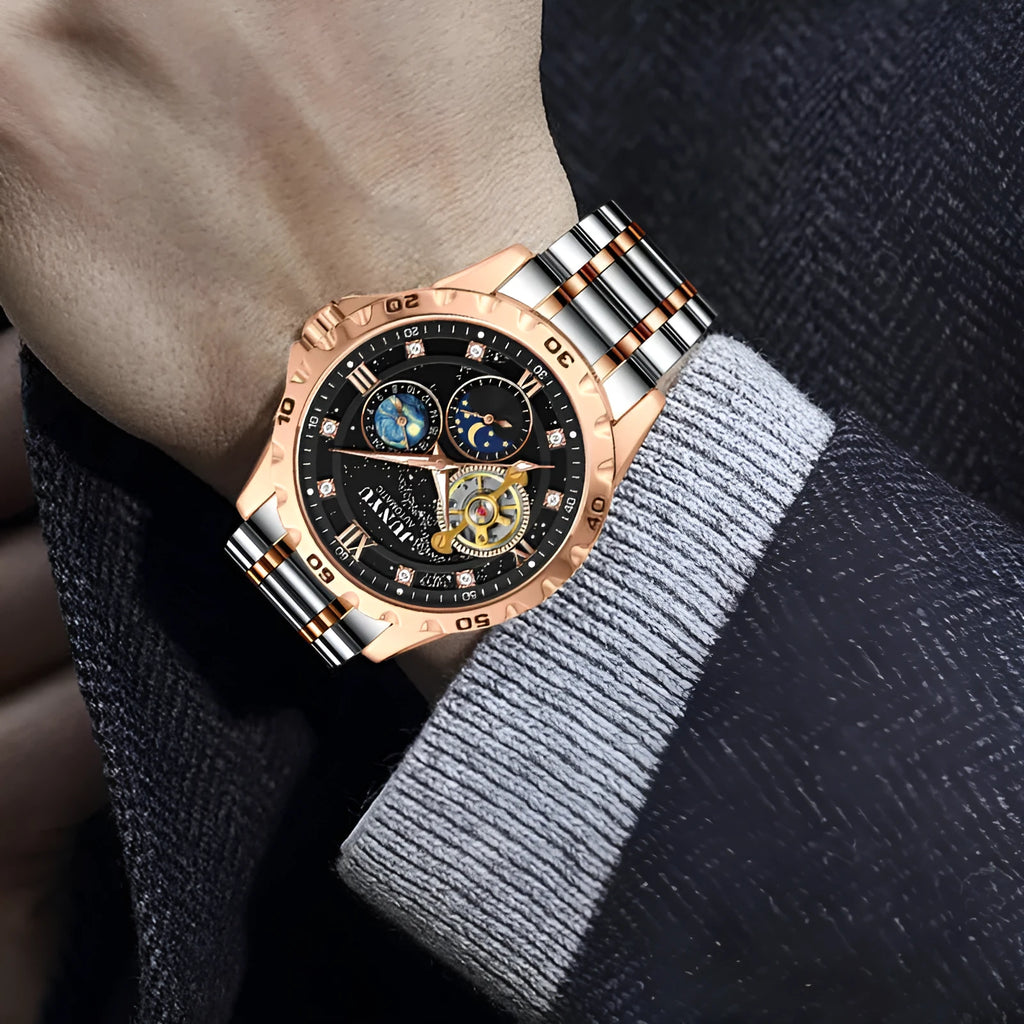 Men's automatic mechanical watch with luminous dial on wrist.