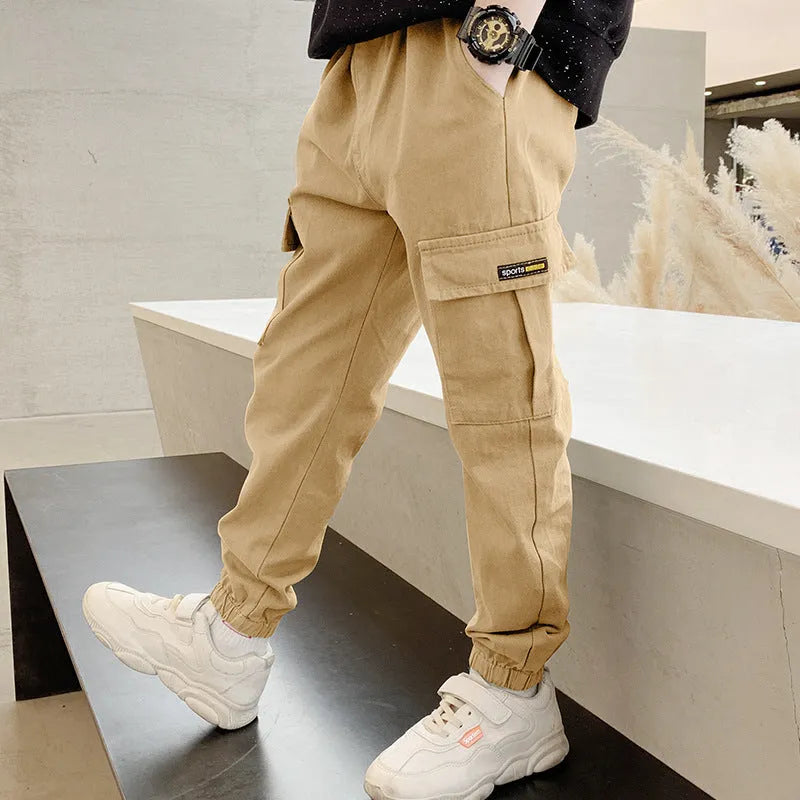 Boys' army green cotton casual trousers with long length, shown on a size chart