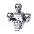 Golden skull ornament with LED light shaped like a skeleton hand holding a candle