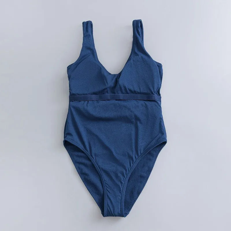 Navy blue women's one-piece swimsuit with triangle neckline, slim fit, and sleeveless design.