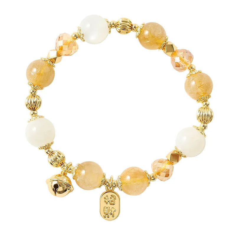 Gold tone rutilated quartz crystal bracelet with electroplated finish and Korean style design